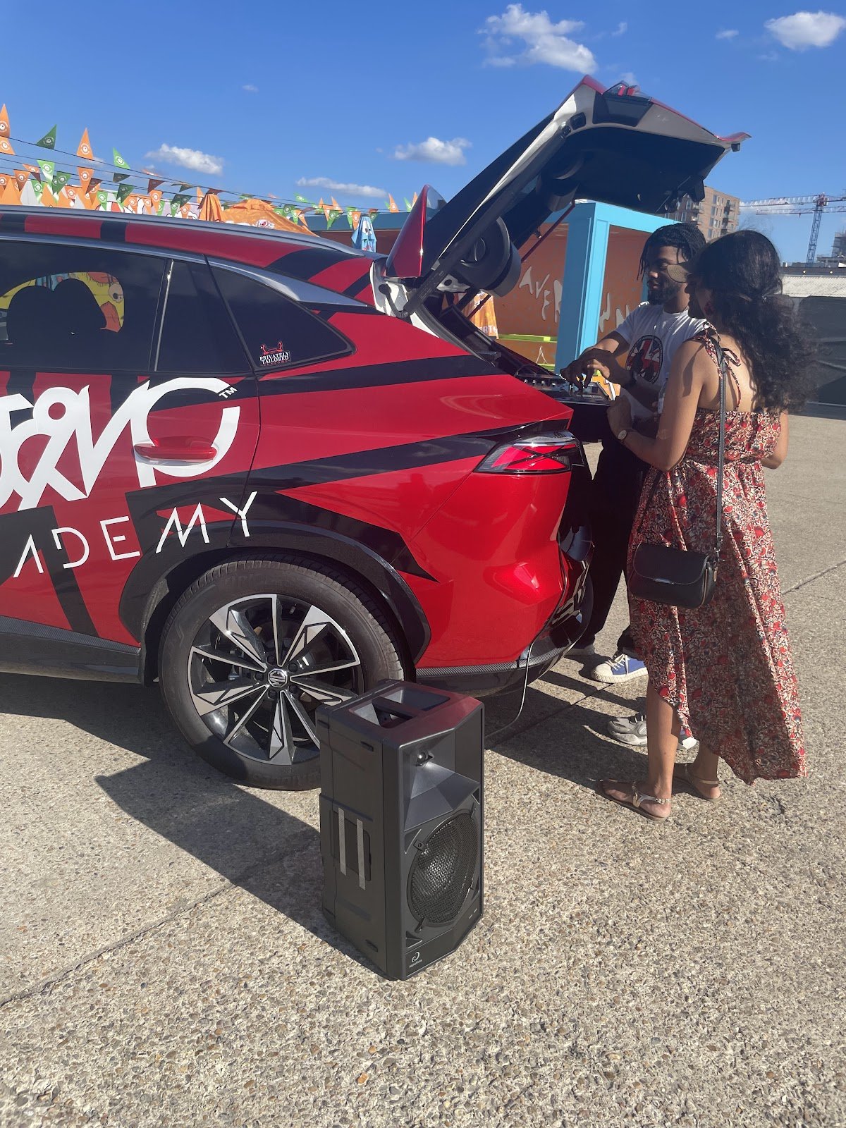 The branded DJ & MC Academy car with speaker set up at a Beavertown activation