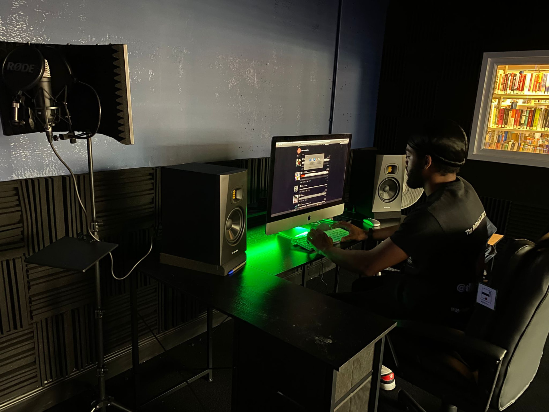 Producer at the desk beside the vocal microphone