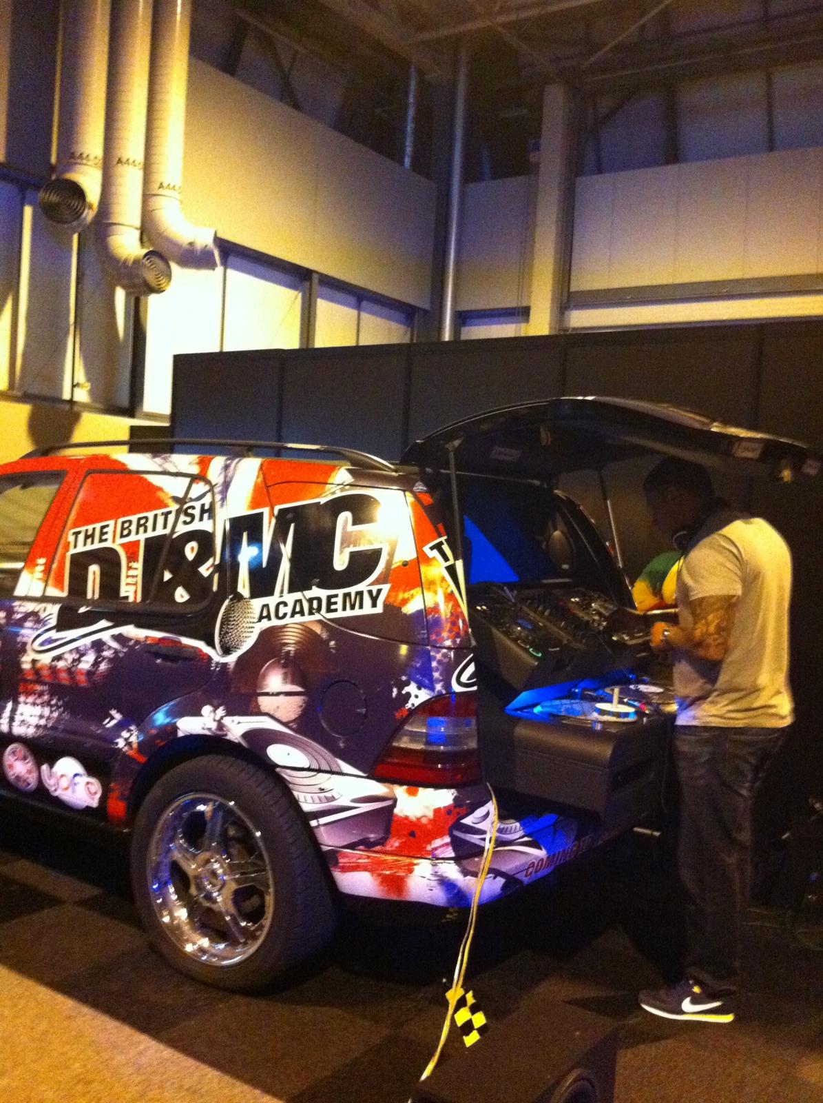 The British DJ & MC Academy branded vehicle with DJ playing from the boot